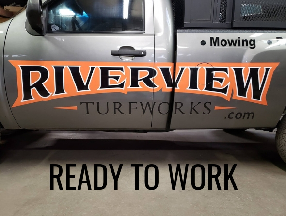 A close up of Riverview Turfworks' logo printed on the side of one of their work trucks.