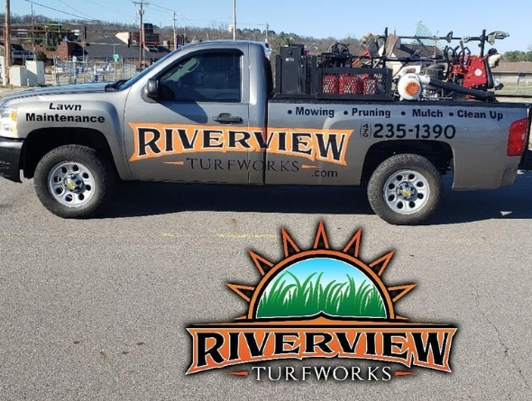 A Riverview Turfworks truck bearing the company's logo and phone number.